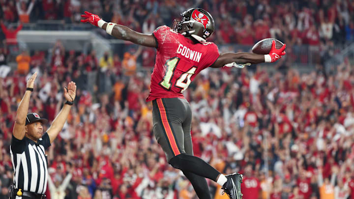 Jan 15, 2024; Tampa, Florida, USA; Tampa Bay Buccaneers wide receiver Chris Godwin (14) celebrates his touchdown against the Philadelphia Eagles during the second half of a 2024 NFC wild card game at Raymond James Stadium. Mandatory Credit: Kim Klement Neitzel-Imagn Images