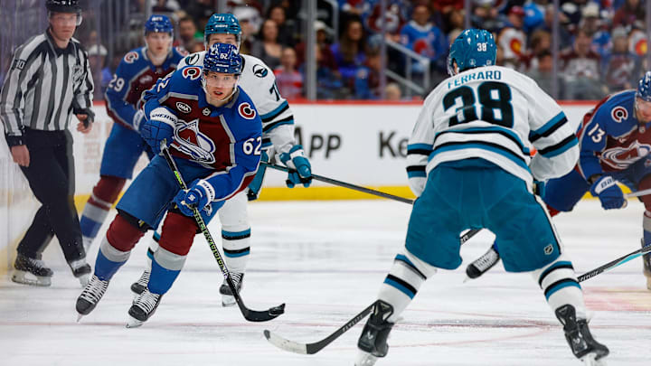 Feb 4, 2026; Denver, Colorado, USA; Colorado Avalanche left wing Artturi Lehkonen (62) plays the puck forward against San Jose Sharks defenseman Mario Ferraro (38) in the second period at Ball Arena. Mandatory Credit: Isaiah J. Downing-Imagn Images