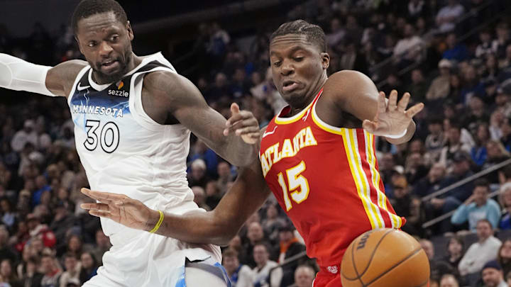 Minnesota Timberwolves forward Julius Randle (30) and Atlanta Hawks center Clint Capela watch as a ball gets away from both of them in the fourth quarter at Target Center in Minneapolis on Jan. 27, 2025.