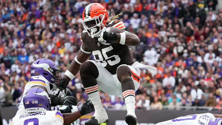 Oct 5, 2025; Tottenham, United Kingdom; Cleveland Browns tight end David Njoku (85) leaps over Minnesota Vikings linebacker Ivan Pace Jr. (0) during the third quarter of an NFL International Series game at Tottenham Hotspur Stadium. Mandatory Credit: Kirby Lee-Imagn Images