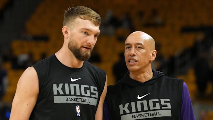 Apr 23, 2023; San Francisco, California, USA; Sacramento Kings forward Domantas Sabonis (left) and assistant coach Doug Christie (right) talk before game four of the 2023 NBA playoffs against the Golden State Warriors at Chase Center. Apr 23, 2023; San Francisco, California, USA; Sacramento Kings forward Domantas Sabonis (left) and assistant coach Doug Christie (right) talk before game four of the 2023 NBA playoffs against the Golden State Warriors at Chase Center.