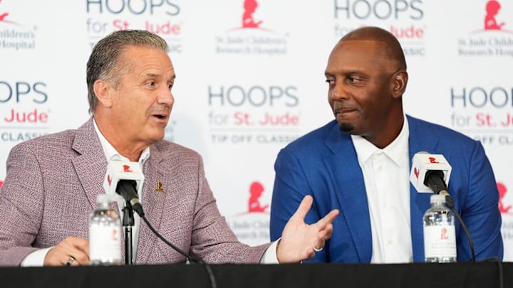 Arkansas men’s basketball head coach John Calipari answers a question as Memphis men’s basketball coach Penny Hardaway looks on during a press conference for the Hoops for St. Jude Tip Off Classic at FedExForum on September 2, 2025.