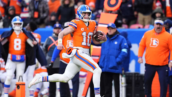 Denver Broncos quarterback Bo Nix scrambles with the ball in the second quarter against the Kansas City Chiefs.