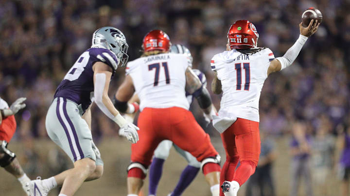 Arizona Wildcats quarterback Noah Fifita (11) throws a pass during the second quarter of the game against Kansas State at Bill Snyder Family Stadium on Friday, September 13, 2024.