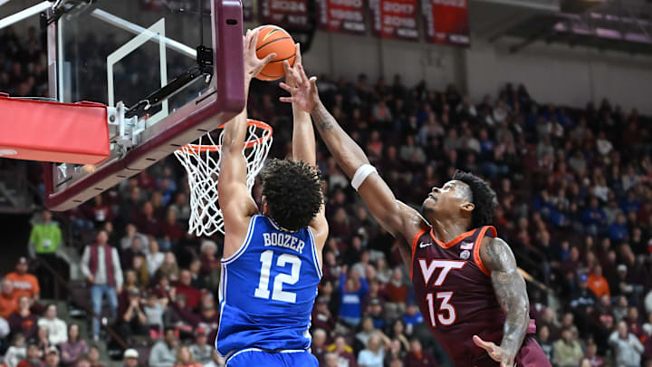 Jan 31, 2026; Blacksburg, Virginia, USA; Duke Blue Devils forward Cameron Boozer (12) catches a alley-oop as Virginia Tech Hokies forward Amani Hansberry (13) defends during the first half at Cassell Coliseum. Mandatory Credit: Brian Bishop-Imagn Images Jan 31, 2026; Blacksburg, Virginia, USA; Duke Blue Devils forward Cameron Boozer (12) catches a alley-oop as Virginia Tech Hokies forward Amani Hansberry (13) defends during the first half at Cassell Coliseum. Mandatory Credit: Brian Bishop-Imagn Images