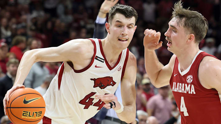 Arkansas Razorbacks forward Zvonimir Ivisic (44) drives against Alabama Crimson Tide forward Grant Nelson (4) during the first half at Bud Walton Arena. 