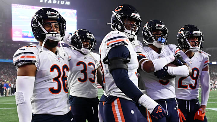 Oct 24, 2022; Foxborough, Massachusetts, USA; Chicago Bears safety DeAndre Houston-Carson (36), cornerback Jaylon Johnson (33), defensive end Dominique Robinson (91), safety Jaquan Brisker (9), and cornerback Dane Cruikshank (29) celebrate after an interception against the New England Patriots during the first half at Gillette Stadium. Mandatory Credit: Brian Fluharty-Imagn Images