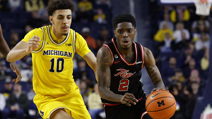 Dec 29, 2024; Ann Arbor, Michigan, USA;  Western Kentucky Hilltoppers guard Don McHenry (2) dribbles against Michigan Wolverines guard Justin Pippen (10) in the second half at Crisler Center. Mandatory Credit: Rick Osentoski-Imagn Images