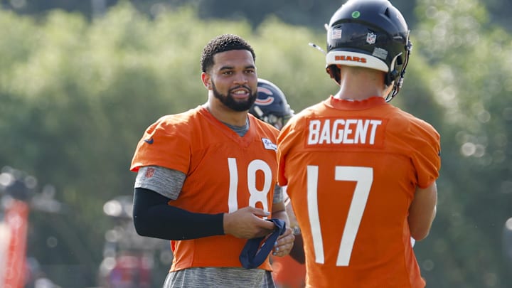 Caleb Williams goes over a few things with backup QB Tyson Bagent during training camp at Hals Hall.