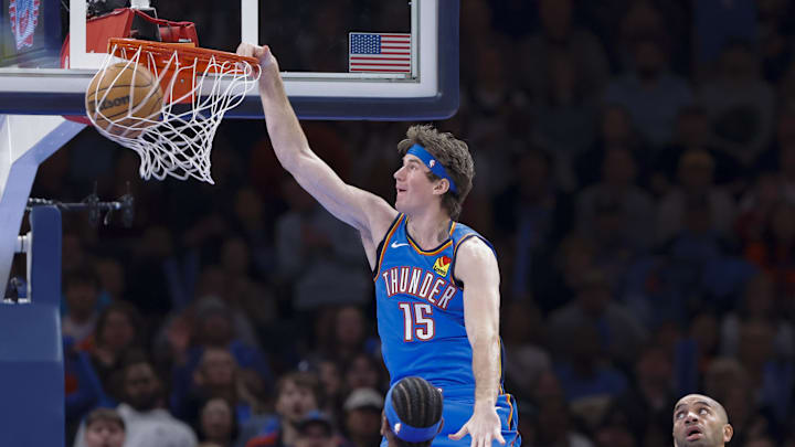 Dec 18, 2025; Oklahoma City, Oklahoma, USA; Oklahoma City Thunder center Branden Carlson (15) dunks against the Los Angeles Clippers during the second half at Paycom Center. Mandatory Credit: Alonzo Adams-Imagn Images