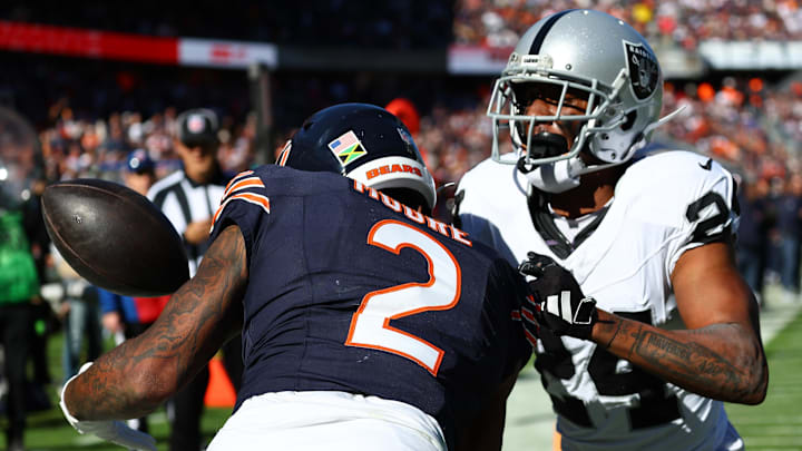 Oct 22, 2023; Chicago, Illinois, USA; Chicago Bears wide receiver DJ Moore (2) attempts to make a catch against  Las Vegas Raiders cornerback Marcus Peters (24) in the second half at Soldier Field. Mandatory Credit: Mike Dinovo-Imagn Images