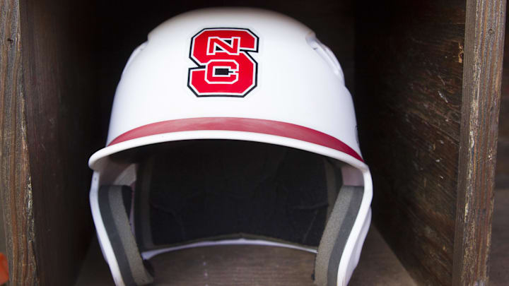 Jun 8, 2013; Raleigh, NC, USA; A North Carolina State Wolfpack helmet lies in the dugout prior to the game against the Rice Owls in the Raleigh super regional of the 2013 NCAA baseball tournament at Doak Field. Mandatory Credit: Jeremy Brevard-Imagn Images