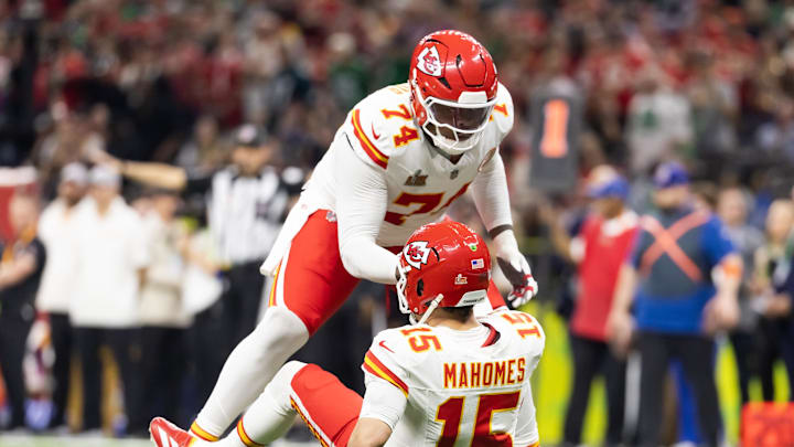 Feb 9, 2025; New Orleans, LA, USA;  Kansas City Chiefs offensive tackle Jawaan Taylor (74) helps up quarterback Patrick Mahomes (15) against the Philadelphia Eagles in Super Bowl LIX at Ceasars Superdome. Mandatory Credit: Mark J. Rebilas-Imagn Images