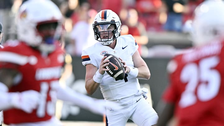 Oct 4, 2025; Louisville, Kentucky, USA; Virginia Cavaliers quarterback Chandler Morris (4) looks to pass against the Louisville Cardinals during the second half at L&N Federal Credit Union Stadium. Virginia defeated Louisville 30-27. Mandatory Credit: Jamie Rhodes-Imagn Images
