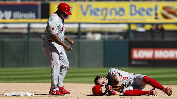 Sep 26, 2024; Chicago, Illinois, USA; Los Angeles Angels shortstop Zach Neto (9) reacts after injuring himself during the fourth inning of a baseball game against the Chicago White Sox at Guaranteed Rate Field. Mandatory Credit: Kamil Krzaczynski-Imagn Images Sep 26, 2024; Chicago, Illinois, USA; Los Angeles Angels shortstop Zach Neto (9) reacts after injuring himself during the fourth inning of a baseball game against the Chicago White Sox at Guaranteed Rate Field. Mandatory Credit: Kamil Krzaczynski-Imagn Images