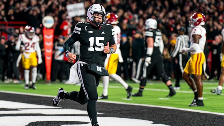 Nov 1, 2025; Lincoln, Nebraska, USA; Nebraska Cornhuskers quarterback Dylan Raiola (15) runs off after scoring a touchdown against the Southern California Trojans during the first quarter at Memorial Stadium. Mandatory Credit: Dylan Widger-Imagn Images