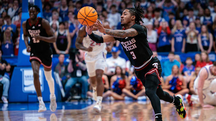 Mar 1, 2025; Lawrence, Kansas, USA; Texas Tech Red Raiders guard Elijah Hawkins (3) passes the ball during the first half against the Kansas Jayhawks at Allen Fieldhouse. Mandatory Credit: William Purnell-Imagn Images