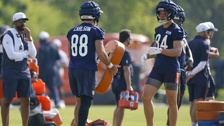 Colston Loveland (84) finishes stretching during warmup prior to practice.
