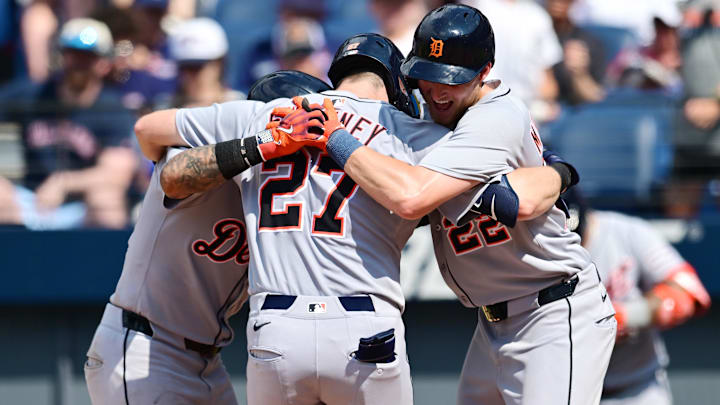 Jul 6, 2025; Cleveland, Ohio, USA; Detroit Tigers shortstop Trey Sweeney (27) celebrates with Javier Baez third baseman (28) and center fielder Parker Meadows (22) after hitting a home run during the tenth inning against the Cleveland Guardians at Progressive Field.