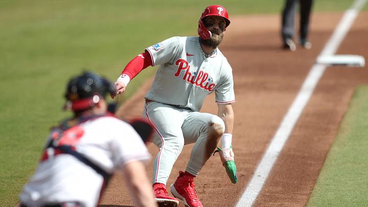 Sep 30, 2026; Cumberland, Georgia, USA;  Philadelphia Phillies outfielder Bryce Harper (3) is caught between third base and homeplate in a rundown against the Atlanta Braves in the first inning during game two of the Wildcard round for the 2026 MLB Playoffs at Truist Park.  Mandatory Credit: Brett Davis-Imagn Images