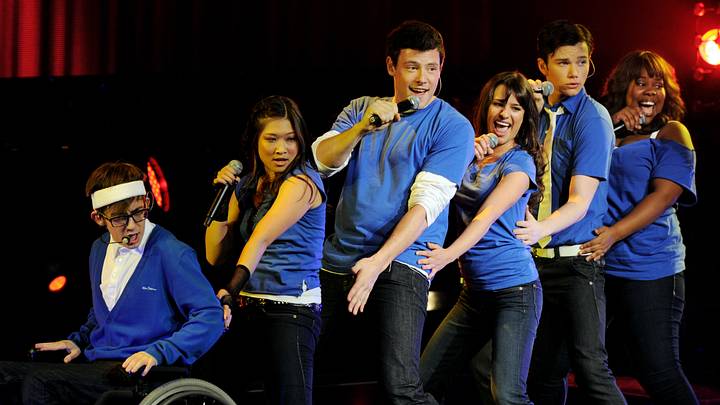 (L-R) Actor/singers Kevin McHale, Jenna Ushkowitz, Cory Monteith, Lea Michele, Chris Colfer and Amber Riley of Fox TV's "Glee" perform at The Gibson Amphitheater on May 20, 2010 in Universal City, California. (L-R) Actor/singers Kevin McHale, Jenna Ushkowitz, Cory Monteith, Lea Michele, Chris Colfer and Amber Riley of Fox TV's "Glee" perform at The Gibson Amphitheater on May 20, 2010 in Universal City, California.