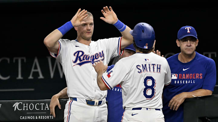 Aug 11, 2025; Arlington, Texas, USA; Texas Rangers third baseman Josh Jung (6) and left fielder Josh Smith (8) celebrates a run scored by Smith against the Arizona Diamondbacks during the sixth inning at Globe Life Field. Aug 11, 2025; Arlington, Texas, USA; Texas Rangers third baseman Josh Jung (6) and left fielder Josh Smith (8) celebrates a run scored by Smith against the Arizona Diamondbacks during the sixth inning at Globe Life Field.