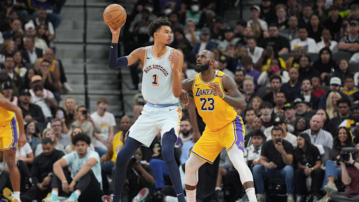 Nov 27, 2024; San Antonio, Texas, USA; San Antonio Spurs center Victor Wembanyama (1) handles the ball in front of Los Angeles Lakers forward LeBron James (23) in the second half at Frost Bank Center. Mandatory Credit: Daniel Dunn-Imagn Images Nov 27, 2024; San Antonio, Texas, USA; San Antonio Spurs center Victor Wembanyama (1) handles the ball in front of Los Angeles Lakers forward LeBron James (23) in the second half at Frost Bank Center. Mandatory Credit: Daniel Dunn-Imagn Images