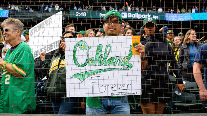 Sep 29, 2024; Seattle, Washington, USA; An Oakland Athletics fan holds a sign after the game between the Seattle Mariners and the Oakland Athletics at T-Mobile Park. Mandatory Credit: Steven Bisig-Imagn Images Sep 29, 2024; Seattle, Washington, USA; An Oakland Athletics fan holds a sign after the game between the Seattle Mariners and the Oakland Athletics at T-Mobile Park. Mandatory Credit: Steven Bisig-Imagn Images