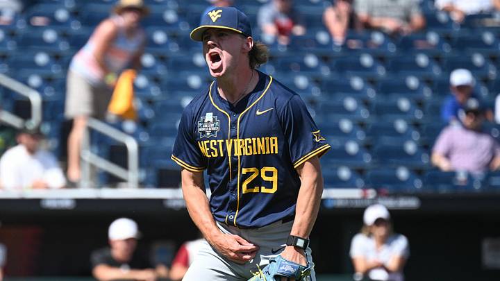 Jun 16, 2026; Omaha, NE, USA; West Virginia Mountaineers pitcher Reese Bassinger (29) reacts in the of the seventh inning against the Troy Trojans at Charles Schwab Field. Mandatory Credit: Steven Branscombe-Imagn Images Jun 16, 2026; Omaha, NE, USA; West Virginia Mountaineers pitcher Reese Bassinger (29) reacts in the of the seventh inning against the Troy Trojans at Charles Schwab Field. Mandatory Credit: Steven Branscombe-Imagn Images