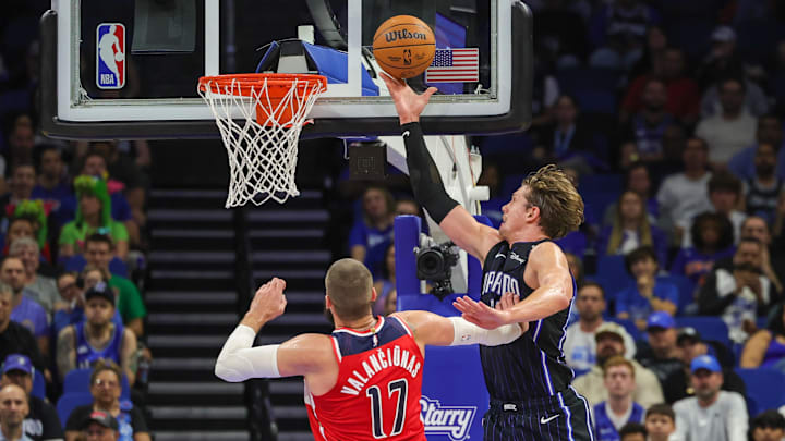 Orlando Magic center Moritz Wagner (21) goes to the basket against Washington Wizards center Jonas Valanciunas (17) during the second quarter at Kia Center.