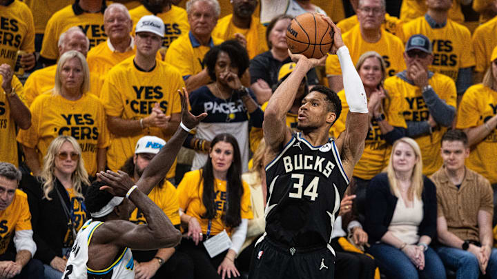 Apr 29, 2025; Indianapolis, Indiana, USA; Milwaukee Bucks forward Giannis Antetokounmpo (34) shoots the ball while  Indiana Pacers forward Pascal Siakam (43) defends during game five of the first round for the 2024 NBA Playoffs at Gainbridge Fieldhouse. Mandatory Credit: Trevor Ruszkowski-Imagn Images