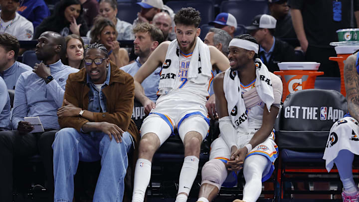 Nov 12, 2025; Oklahoma City, Oklahoma, USA; Oklahoma City Thunder guard Jalen Williams (8), center Chet Holmgren (7), and guard Shai Gilgeous-Alexander (2) talk while sitting on the bench during the fourth quarter against the Los Angeles Lakers at Paycom Center. Mandatory Credit: Alonzo Adams-Imagn Images