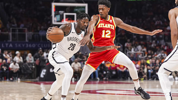 Oct 23, 2024; Atlanta, Georgia, USA; Brooklyn Nets forward Dorian Finney-Smith (28) dribbles against Atlanta Hawks forward De'Andre Hunter (12) during the first half at State Farm Arena. Mandatory Credit: Dale Zanine-Imagn Images Oct 23, 2024; Atlanta, Georgia, USA; Brooklyn Nets forward Dorian Finney-Smith (28) dribbles against Atlanta Hawks forward De'Andre Hunter (12) during the first half at State Farm Arena. Mandatory Credit: Dale Zanine-Imagn Images