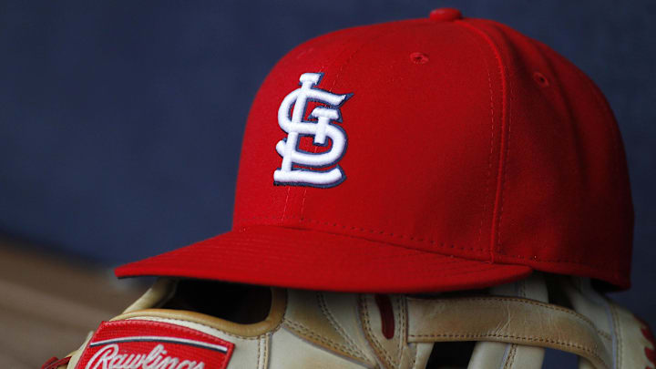 Oct 4, 2015; Atlanta, GA, USA; Detailed view of St. Louis Cardinals hat and glove in the dugout against the Atlanta Braves in the ninth inning at Turner Field. The Braves defeated the Cardinals 2-0. Mandatory Credit: Brett Davis-Imagn Images Oct 4, 2015; Atlanta, GA, USA; Detailed view of St. Louis Cardinals hat and glove in the dugout against the Atlanta Braves in the ninth inning at Turner Field. The Braves defeated the Cardinals 2-0. Mandatory Credit: Brett Davis-Imagn Images