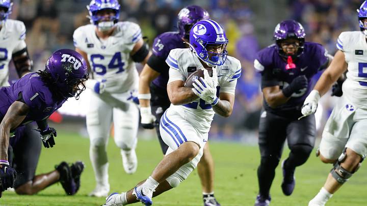 Oct 3, 2026; Fort Worth, Texas, USA;  BYU Cougars running back Journee Tonga (20) carries the ball against the TCU Horned Frogs during the second half at Amon G. Carter Stadium.  Mandatory Credit: Chris Jones-Imagn Images