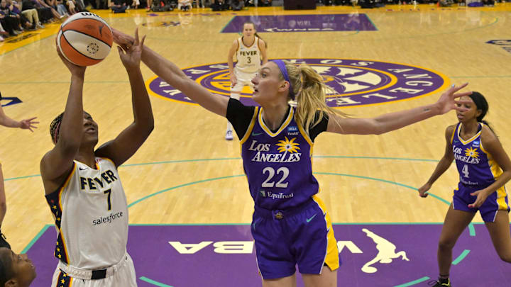 May 24, 2024; Los Angeles, California, USA;  Los Angeles Sparks forward Cameron Brink (22) blocks a shot by Indiana Fever forward Aliyah Boston (7) in the first half at Crypto.com Arena. Mandatory Credit: Jayne Kamin-Oncea-Imagn Images
