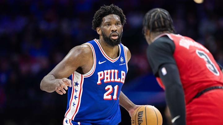 Jan 2, 2024; Philadelphia, Pennsylvania, USA; Philadelphia 76ers center Joel Embiid (21) dribbles the ball against Chicago Bulls center Andre Drummond (3) during the second quarter at Wells Fargo Center. Mandatory Credit: Bill Streicher-Imagn Images Jan 2, 2024; Philadelphia, Pennsylvania, USA; Philadelphia 76ers center Joel Embiid (21) dribbles the ball against Chicago Bulls center Andre Drummond (3) during the second quarter at Wells Fargo Center. Mandatory Credit: Bill Streicher-Imagn Images