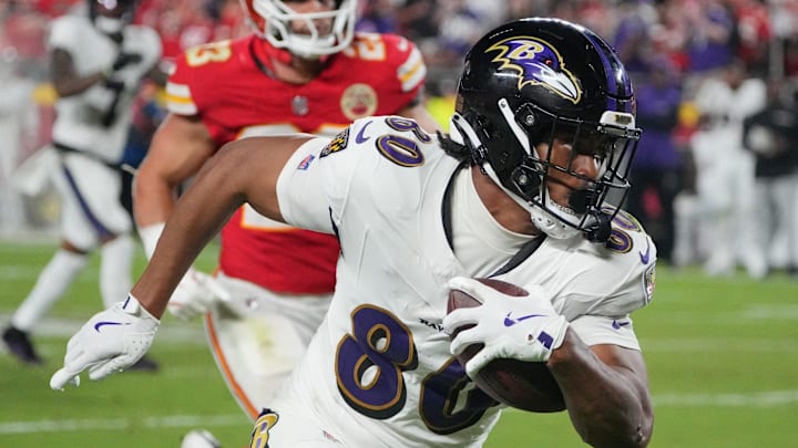 Sep 5, 2024; Kansas City, Missouri, USA; Baltimore Ravens tight end Isaiah Likely (80) runs the ball against the Kansas City Chiefs during the second half at GEHA Field at Arrowhead Stadium. Mandatory Credit: Denny Medley-Imagn Images
