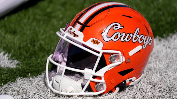 An Oklahoma State helmet is pictured before a college football game between the Oklahoma State Cowboys (OSU) and the West Virginia Mountaineers at Boone Pickens Stadium in Stillwater, Okla., Saturday, Oct. 5, 2024. An Oklahoma State helmet is pictured before a college football game between the Oklahoma State Cowboys (OSU) and the West Virginia Mountaineers at Boone Pickens Stadium in Stillwater, Okla., Saturday, Oct. 5, 2024.
