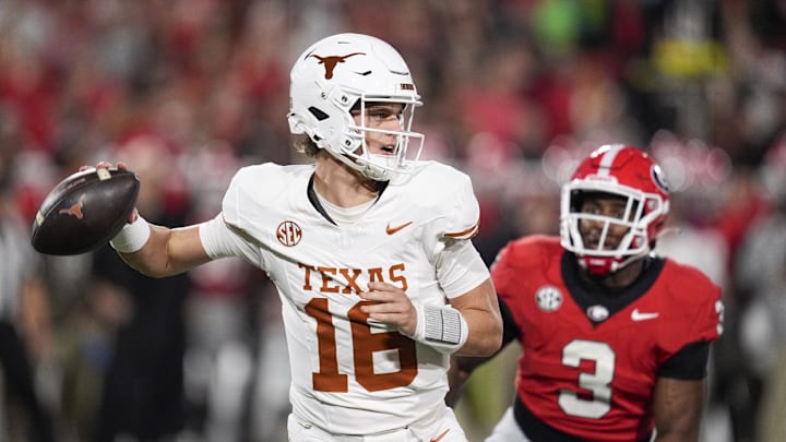 Texas Longhorns quarterback Arch Manning looks to make a pass during the first half against the Georgia Bulldogs at Sanford Stadium.