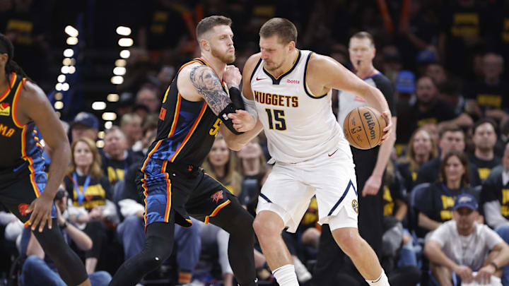 May 7, 2025; Oklahoma City, Oklahoma, USA; Denver Nuggets center Nikola Jokic (15) backs down Oklahoma City Thunder center Isaiah Hartenstein (55) in the second half during Game 2 of the second round at Paycom Center. Mandatory Credit: Alonzo Adams-Imagn Images