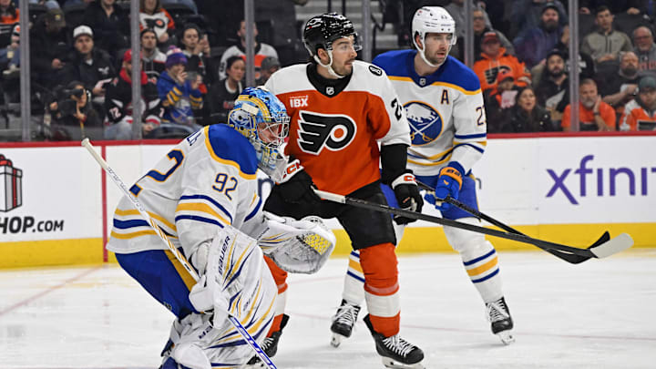 Dec 3, 2025; Philadelphia, Pennsylvania, USA; Philadelphia Flyers left wing Noah Cates (27) battle for the puck with Buffalo Sabres goaltender Colten Ellis (92) and defenseman Mattias Samuelsson (23) during the second period at Xfinity Mobile Arena. Mandatory Credit: Eric Hartline-Imagn Images Dec 3, 2025; Philadelphia, Pennsylvania, USA; Philadelphia Flyers left wing Noah Cates (27) battle for the puck with Buffalo Sabres goaltender Colten Ellis (92) and defenseman Mattias Samuelsson (23) during the second period at Xfinity Mobile Arena. Mandatory Credit: Eric Hartline-Imagn Images