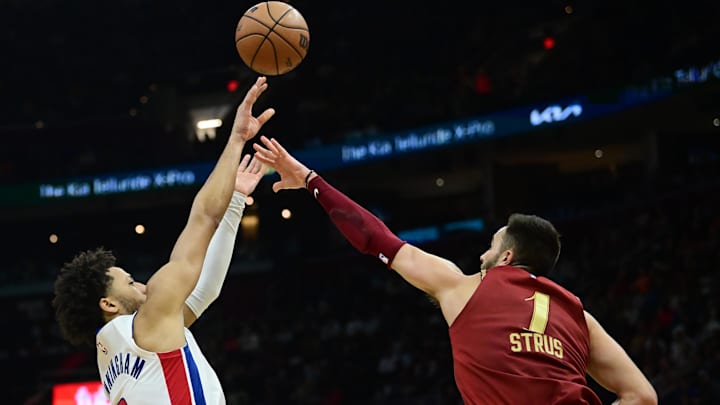 Nov 17, 2023; Cleveland, Ohio, USA; Detroit Pistons guard Cade Cunningham (2) shoots over the defense of Cleveland Cavaliers guard Max Strus (1) during the second half at Rocket Mortgage FieldHouse. Mandatory Credit: Ken Blaze-Imagn Images