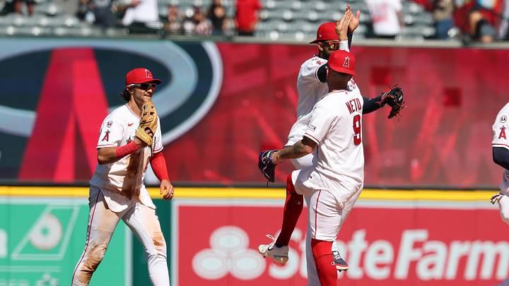 May 6, 2026; Anaheim, California, USA;  Los Angeles Angels shortstop Zach Neto (9) celebrates a win with right fielder Jo Adell (second from right) after defeating the Chicago White Sox 8-2 at Angel Stadium. Mandatory Credit: Kiyoshi Mio-Imagn Images