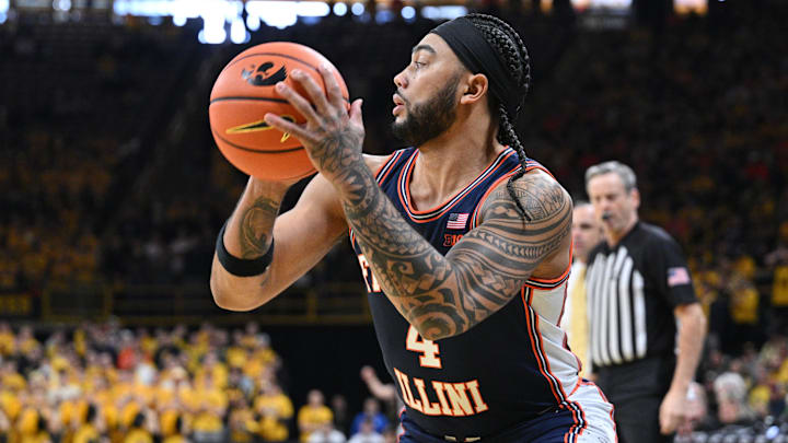 Jan 11, 2026; Iowa City, Iowa, USA; Illinois Fighting Illini guard Kylan Boswell (4) controls the ball against the Iowa Hawkeyes during the first half at Carver-Hawkeye Arena. Mandatory Credit: Jeffrey Becker-Imagn Images