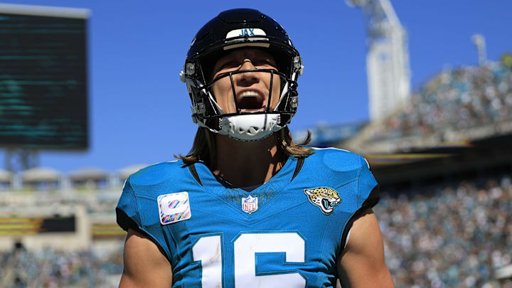 Jacksonville Jaguars quarterback Trevor Lawrence (16) yells after wide receiver Christian Kirk (13).