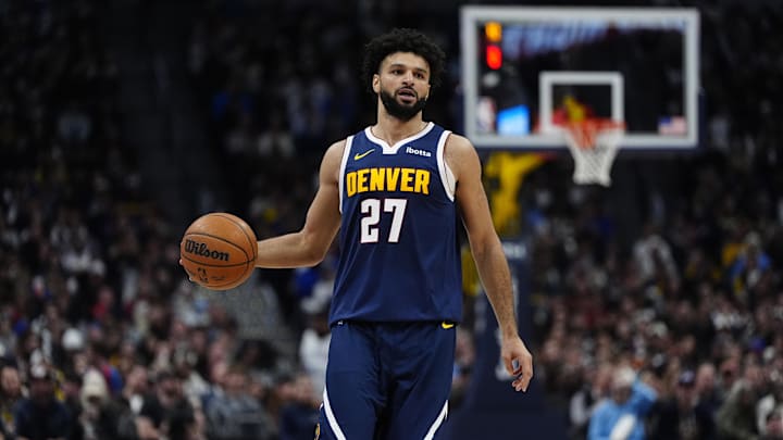 Feb 20, 2025; Denver, Colorado, USA; Denver Nuggets guard Jamal Murray (27) controls the ball in the second half against the Charlotte Hornets at Ball Arena. Mandatory Credit: Ron Chenoy-Imagn Images