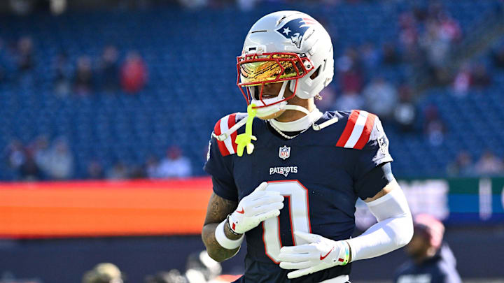 Nov 2, 2025; Foxborough, Massachusetts, USA; New England Patriots cornerback Christian Gonzalez (0) warms up before a game against the Atlanta Falcons at Gillette Stadium. Mandatory Credit: Eric Canha-Imagn Images