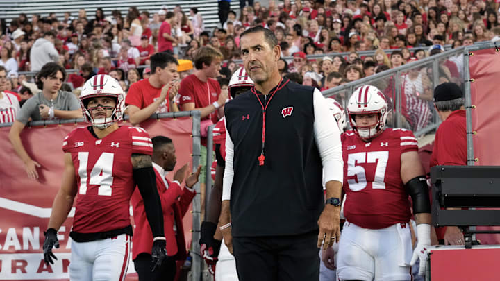 Aug 28, 2025; Madison, Wisconsin, USA;  Wisconsin Badgers head coach Luke Fickell walks onto the field for warmups prior to the game against the Miami (OH) RedHawks at Camp Randall Stadium. Mandatory Credit: Jeff Hanisch-Imagn Images