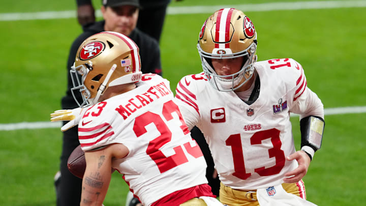 Feb 11, 2024; Paradise, Nevada, USA; San Francisco 49ers quarterback Brock Purdy (13) hands off to San Francisco 49ers running back Christian McCaffrey (23) as they warm up before playing the Kansas City Chiefs in Super Bowl LVIII at Allegiant Stadium. Mandatory Credit: Stephen R. Sylvanie-Imagn Images